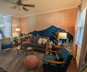 Smart TV, fireplace, books, music library