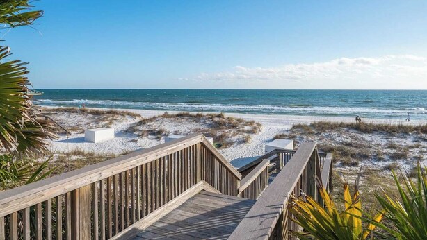 A wooden boardwalk leading to a beach with sand dunes and ocean views. - Heated Pool • Steps to Beach w/ Private Access (Miramar Beach)