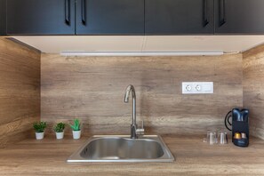 Mini-fridge, stovetop, espresso maker, electric kettle