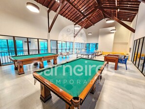 A pool hall with multiple pool tables, a ping pong table, and a billiards table. - Beach Class Residence Eco Life (Ipojuca)