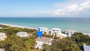 A coastal property with multiple buildings, a beachfront, and dense greenery. - Orchid Island Family Getaway w/Private Beach and Hot Tub (Vero Beach)