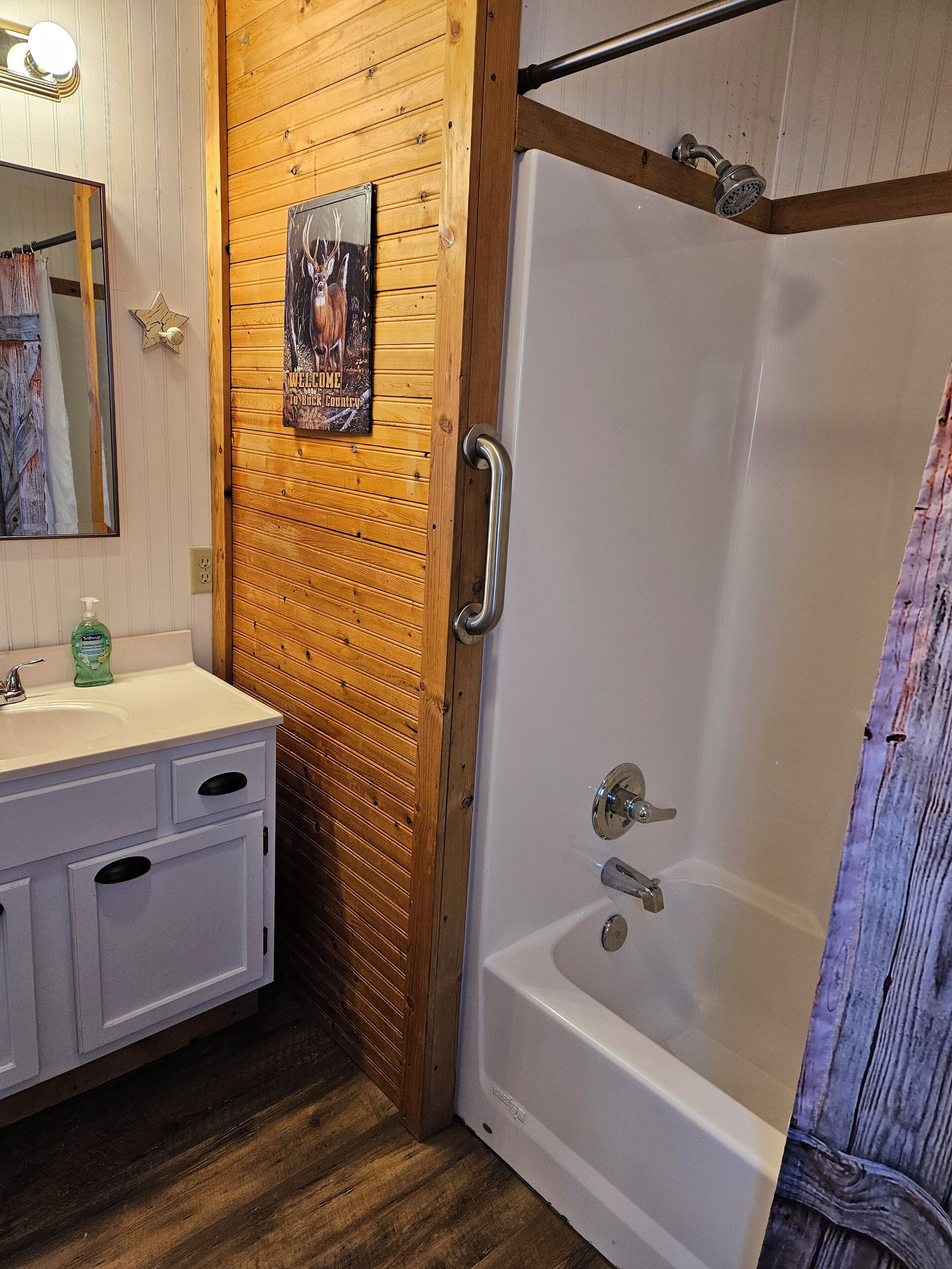 Combined shower/bathtub, hair dryer, towels, soap