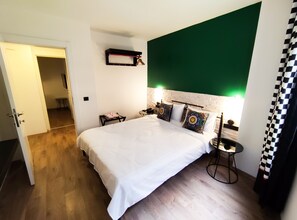 Family Room, 2 Bedrooms | Free minibar, individually decorated, desk, laptop workspace