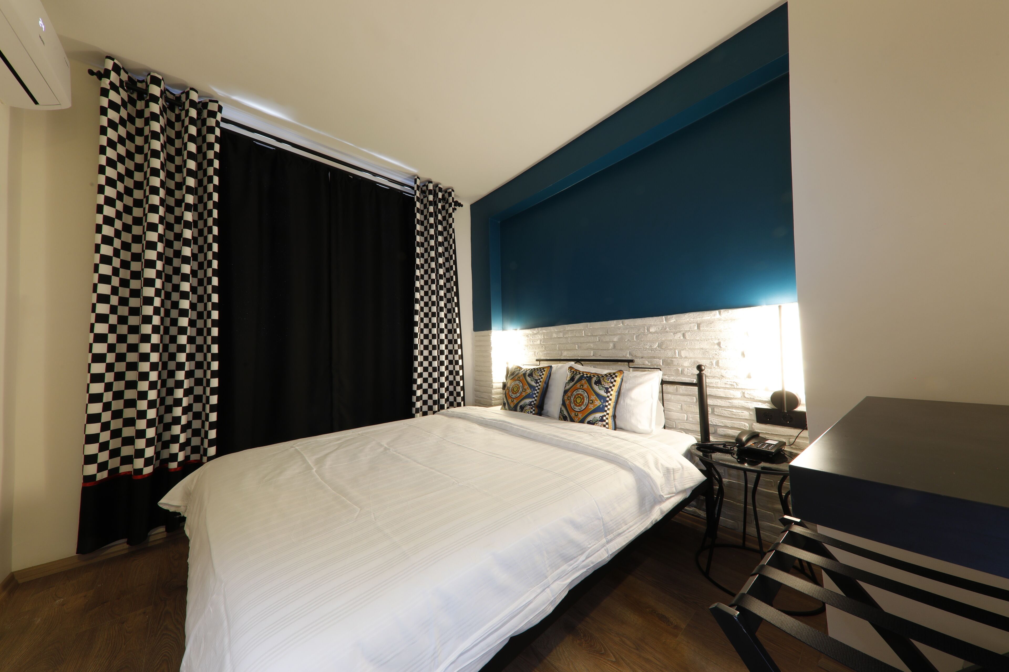 Economy Double Room | Free minibar, individually decorated, desk, laptop workspace