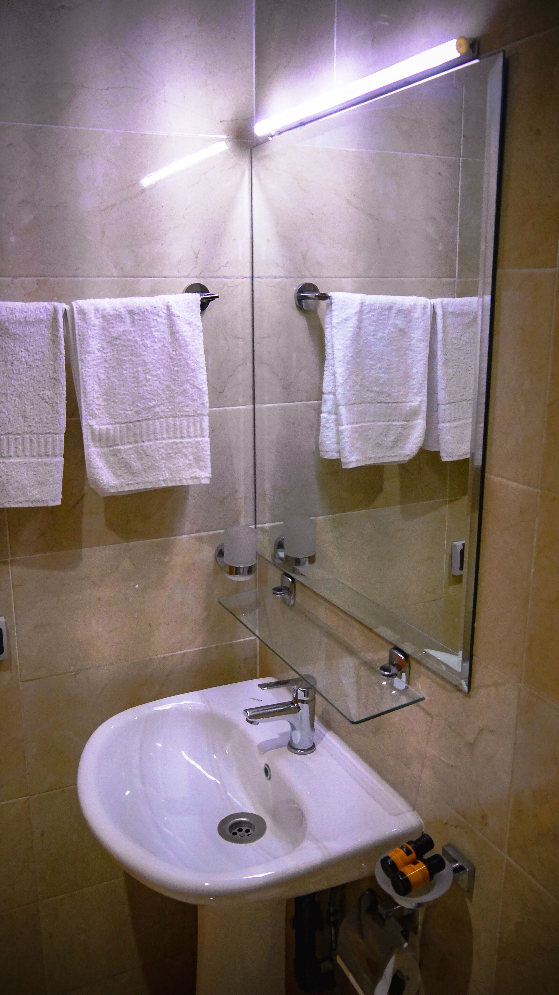 Shower, rainfall showerhead, towels