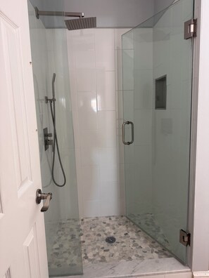 Shower, hair dryer, towels, toilet paper