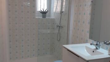 Shower, hair dryer, towels, toilet paper