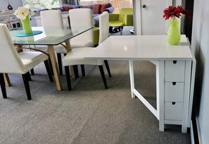 A modern office space with a glass-top table, white chairs, and a white desk with drawers. - “Stunning Views!” Luxury 4 Bedroom, 2 Bathroom Vacation Duplex in Downtown Salt Lake Capitol Hill (Salt Lake City)