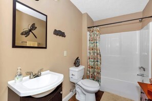 Combined shower/bathtub, towels, soap, toilet paper