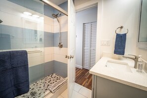Shower, hair dryer, towels, soap