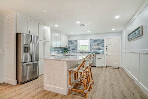 Fridge, microwave, oven, stovetop - Luxury Beach Escape - Newly Renovated, Waterfront, & private dock! (Jensen Beach)