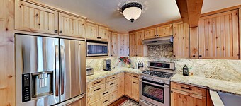 Custom, luxe condo with panoramic lake/mountain views & fireplaces