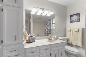 Combined shower/tub, hair dryer, towels, soap