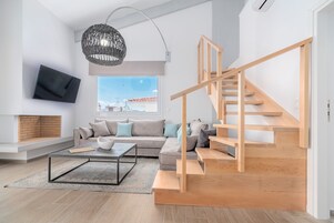 Boutique Apartment AZUL | Living area | Fireplace