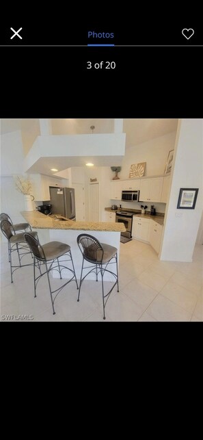 Paper towels, dining tables - Private Tropical Oasis with Heated pool on the water (Cape Coral)