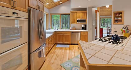 Among the trees w/private hot tub, dog friendly, shared pools, golf, shuffleboard & foosball