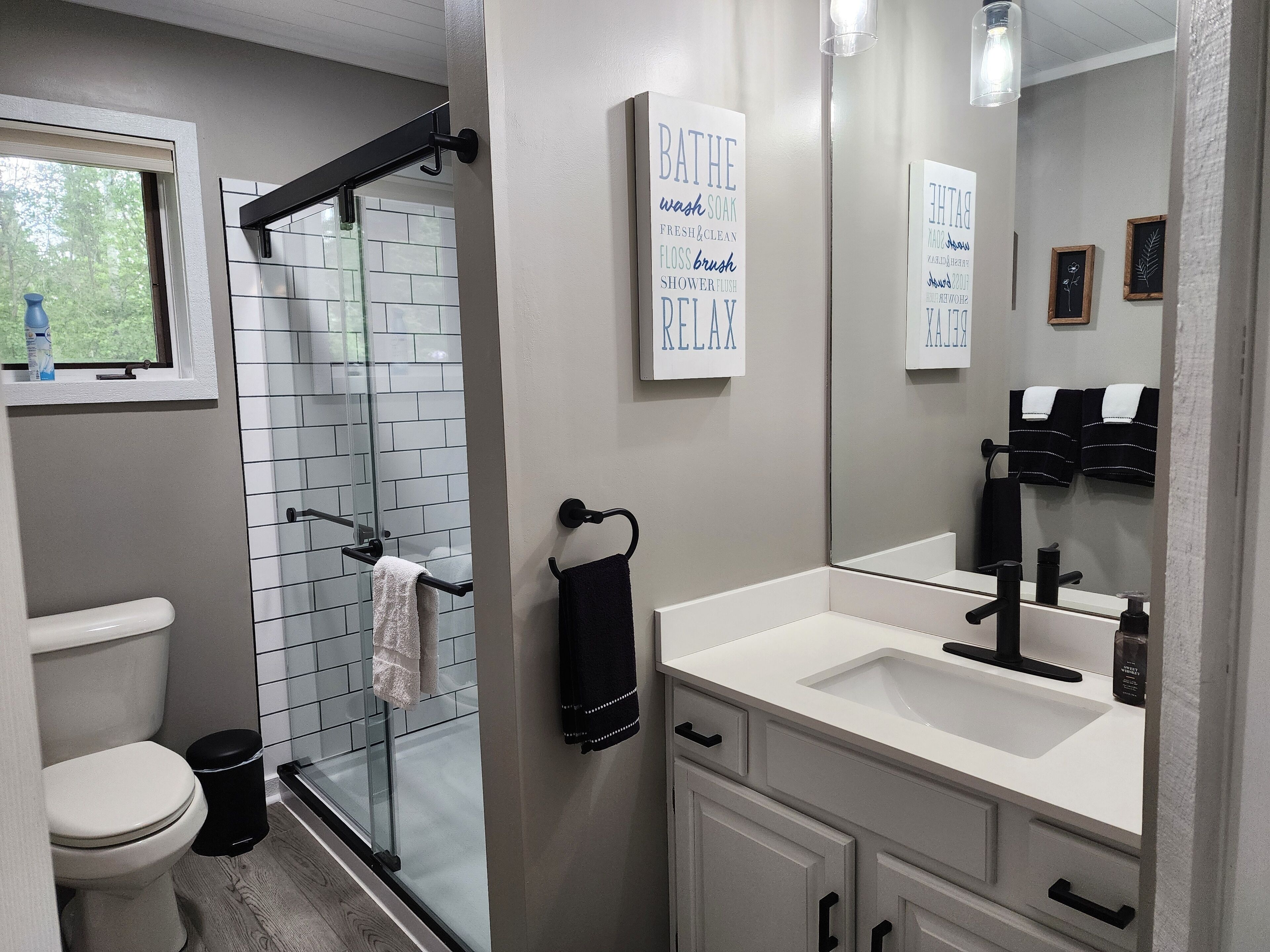 Combined shower/tub, hair dryer, towels, soap