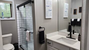 Combined shower/tub, hair dryer, towels, soap