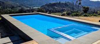 Exquisite modern getaway with private hot tub & pool + large deck w/valley-view
