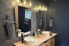 Shower, hair dryer, towels, shampoo