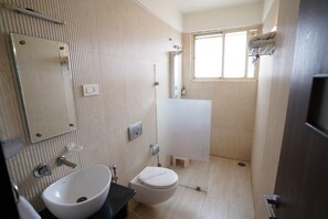 Club Room | Bathroom | Shower, free toiletries, slippers, towels - Metropolis Hotel (Hubli)