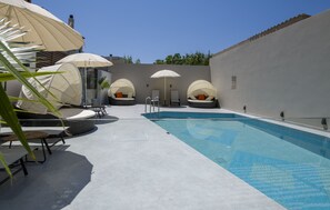 Outdoor pool, free pool cabanas, pool umbrellas