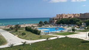 A resort with a swimming pool, beach, and ocean view. - Naturist Baja house with courtyard in first line! (Vera)