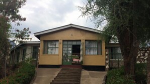A two-story building with a flat roof and a central entrance. - Sego Safari Lodge (Eldoret)