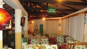 A restaurant with booths and a high ceiling. - Sego Safari Lodge (Eldoret)