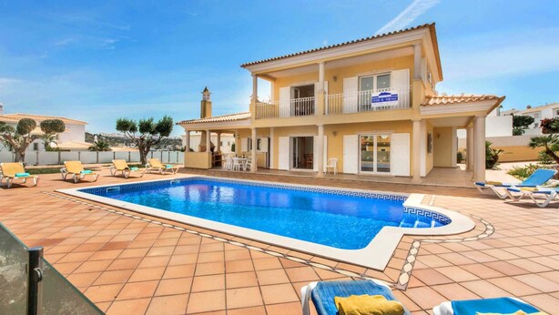 A two-story house with a swimming pool, outdoor furniture, and a view of the sea. - Villa Das Oliveiras, Large grounds, walk to Marina (Albufeira)