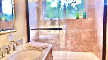 Combined shower/bathtub, eco-friendly toiletries, hair dryer, towels