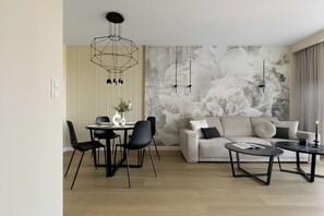 Deluxe Apartment | Living area | 50-inch plasma TV with cable channels, TV - Elite Apartments Tarasy Bałtyku (Gdansk)