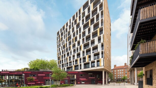 A modern high-rise building with a grid of balconies and a flat roof. - The Hackney Studio Penthouse (London)