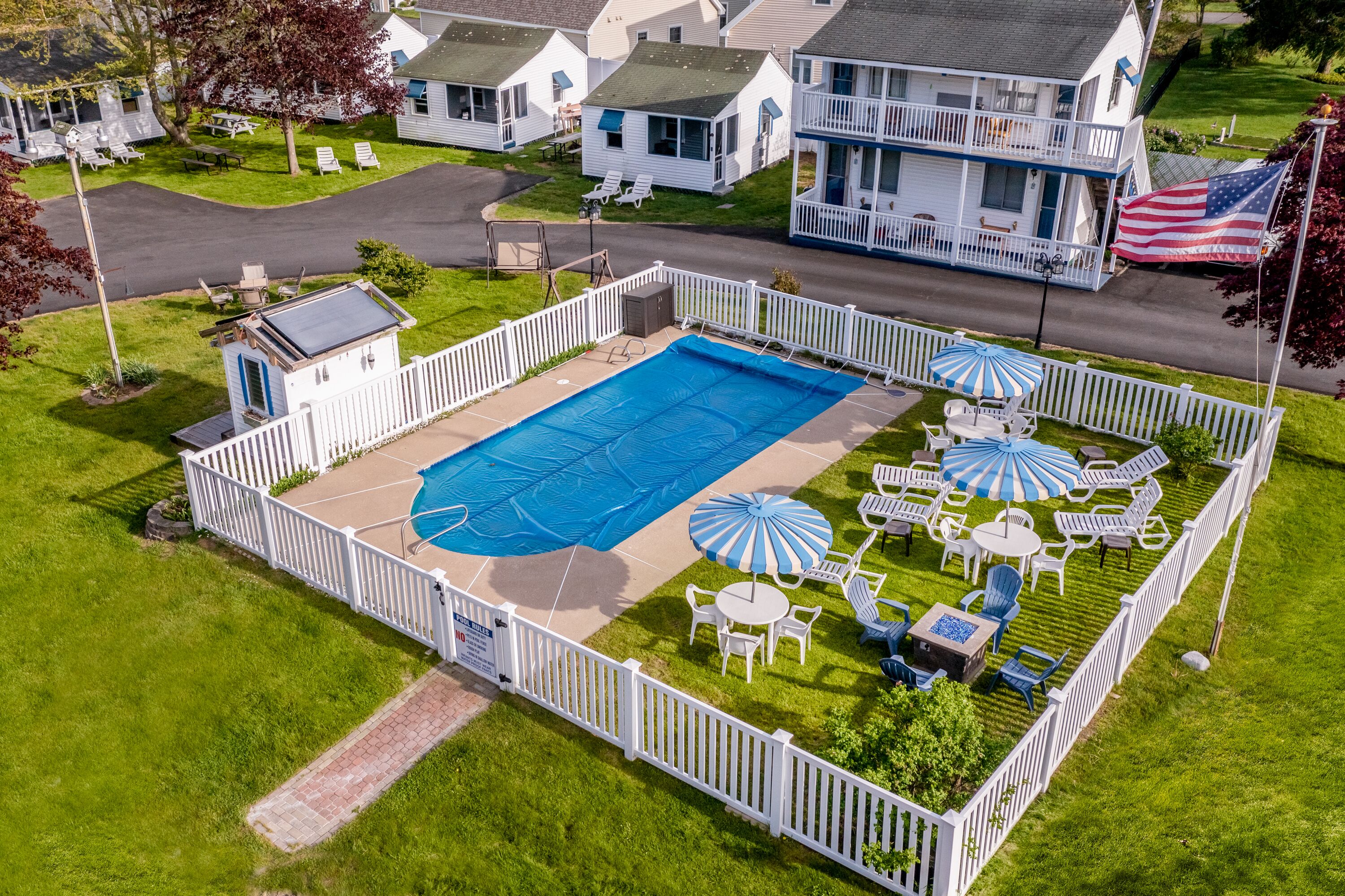 Seasonal outdoor pool, pool umbrellas, pool loungers