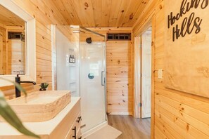 Shower, hair dryer, towels, shampoo