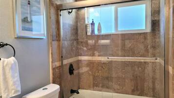 Combined shower/tub, hair dryer, towels, soap