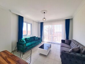 Family Apartment, 2 Bedrooms, Balcony, Sea View | Living area