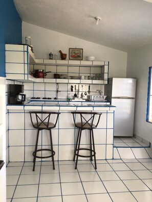 Fridge, microwave, stovetop, coffee/tea maker