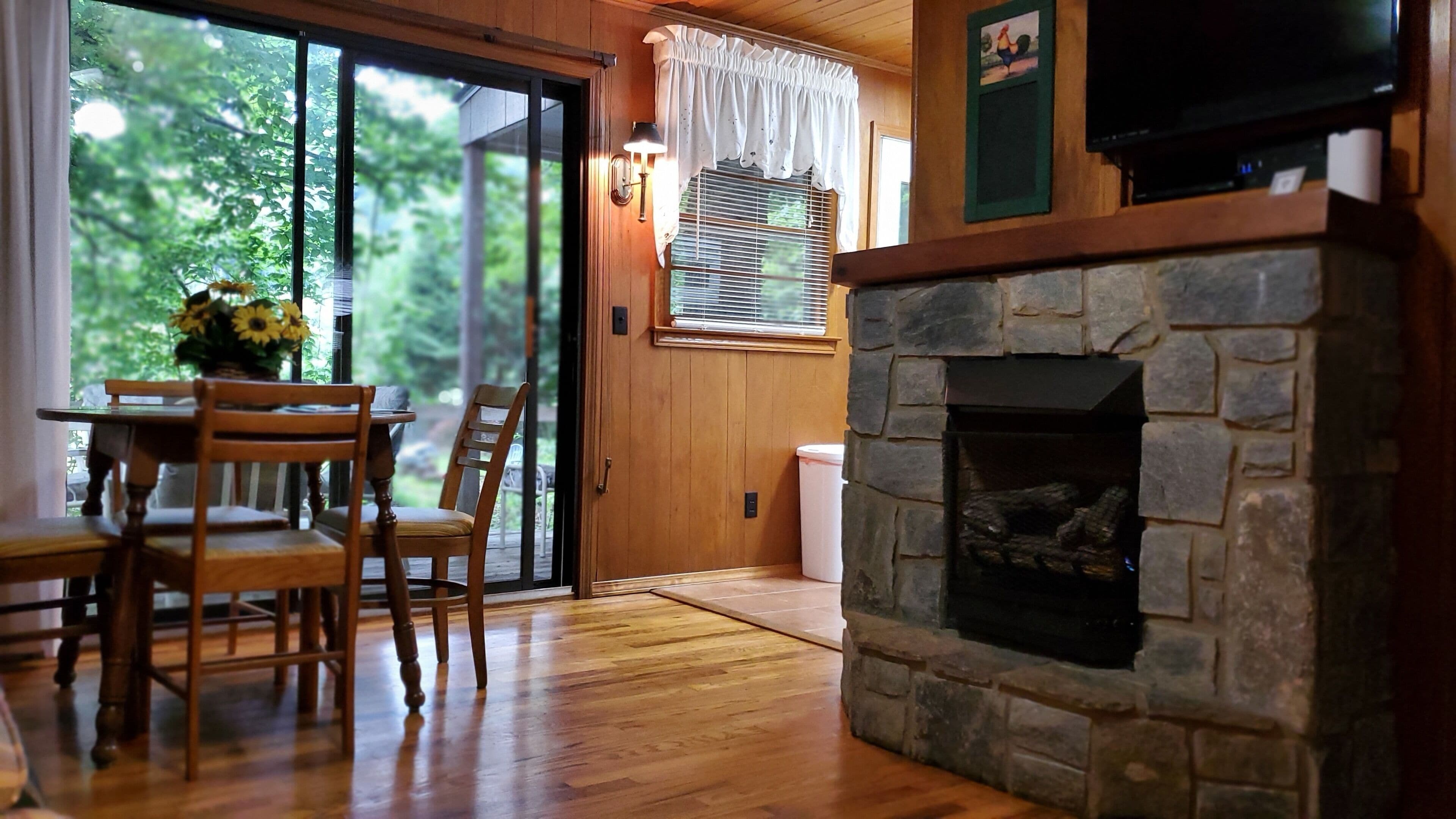 Premium Cottage, River View | Living area | 40-inch LED TV with digital channels, TV, fireplace
