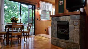Premium Cottage, River View | Living area | 40-inch LED TV with digital channels, TV, fireplace