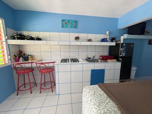 Fridge, microwave, stovetop, coffee/tea maker