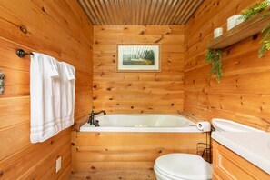 Bathtub, jetted tub, towels, soap
