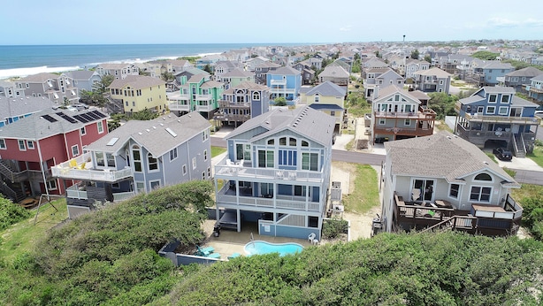 A residential area with houses, a swimming pool, and a view of the ocean. - Oceanside, Pool Table, Private Pool, Close to Beach! OS9Q, Someday Came (Corolla)