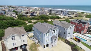 A residential area with houses near a beach, featuring a swimming pool and a vehicle. - Oceanside, Pool Table, Private Pool, Close to Beach! OS9Q, Someday Came (Corolla)