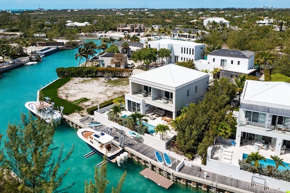 Enjoy a pool and dock with stunning views of the surrounding landscape from this property's spacious outdoor area.