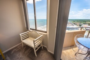 Enjoy a beach view from the comfort of your room, with a bench and table on the balcony.