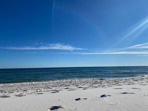 A beach with clear skies and calm waters.