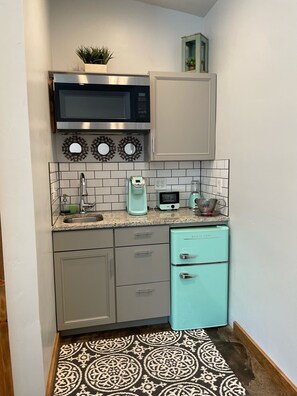 Microwave, coffee/tea maker, cookware/dishes/utensils, spices