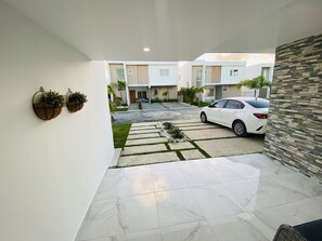 Enjoy a serene retreat amidst lush gardens and a modern, minimalist design.