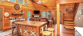 Gorgeous custom log cabin on 185 acres